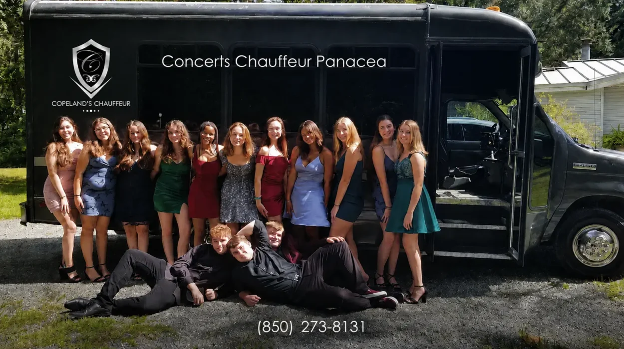 Concerts chauffeur service in Panacea with a group beside a party bus