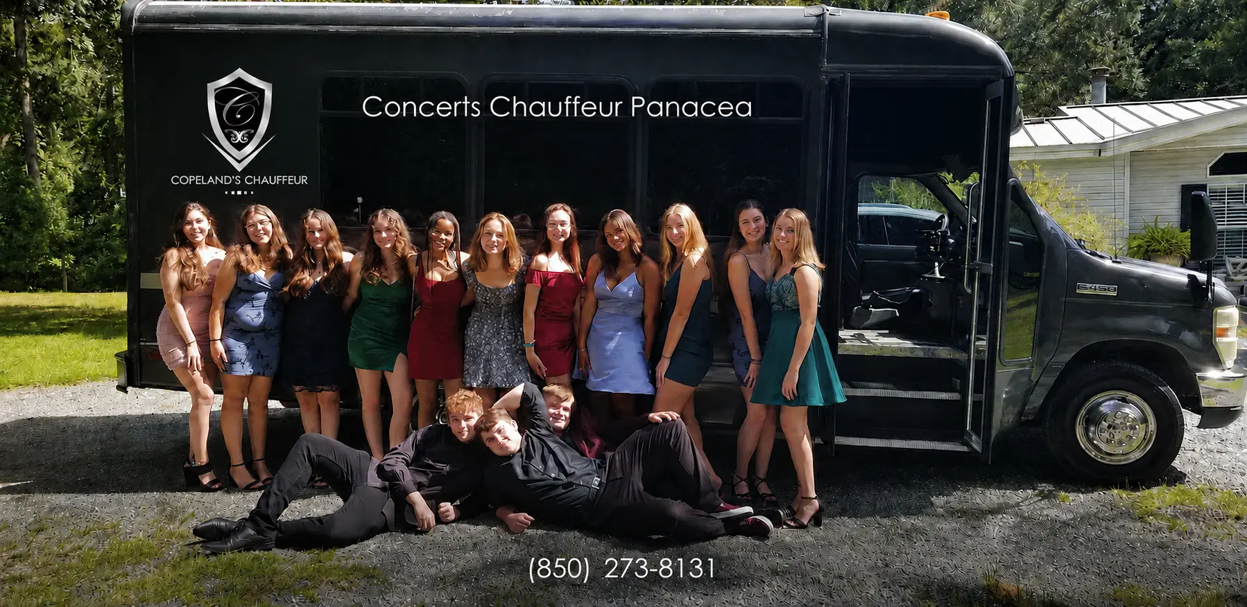 Concerts chauffeur service in Panacea with a group beside a party bus