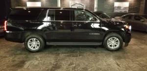 Copeland’s Premium Chauffeur black car waiting outside an airport terminal for a passenger travelling from Crawfordville.